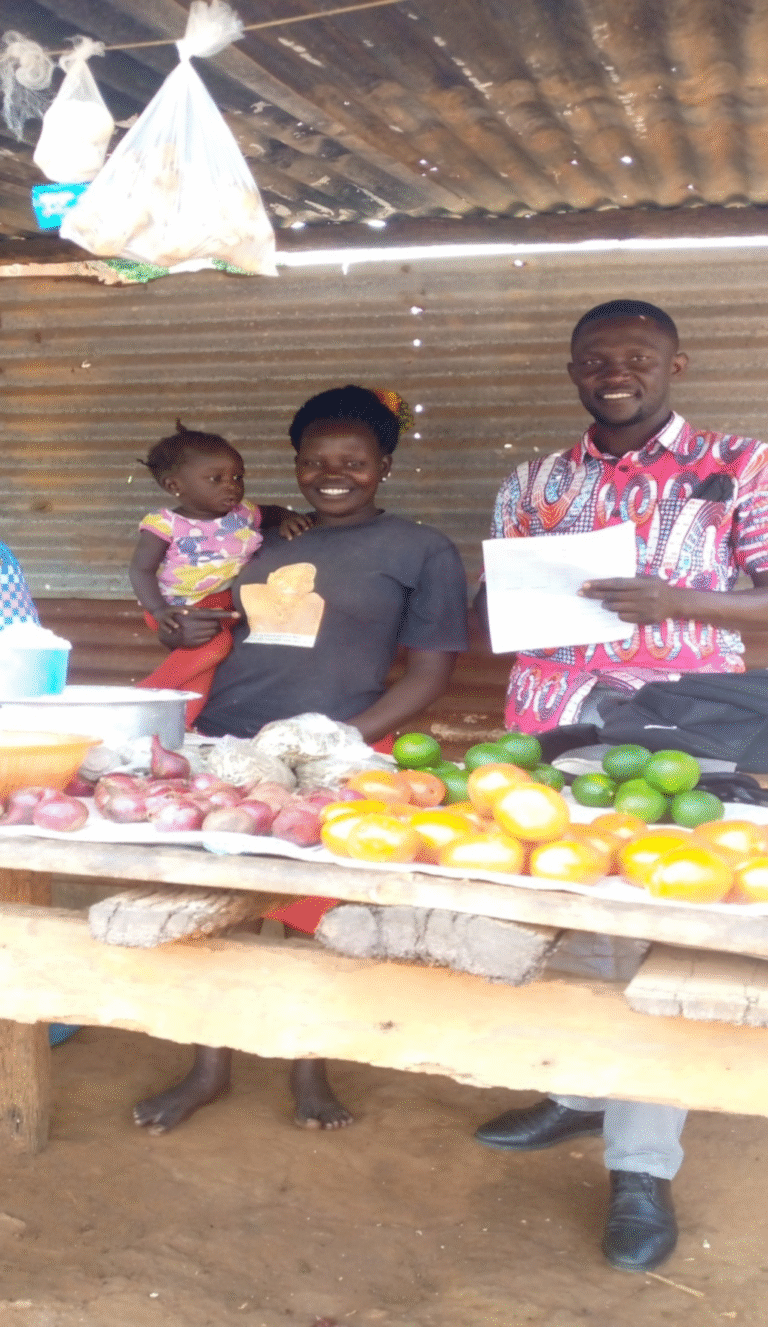 Micro-credit field staff carrying out monitoring to group member who started up