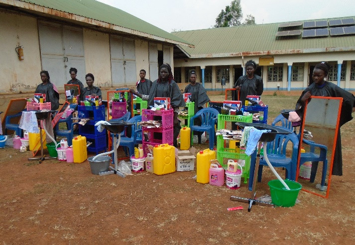 The above photo show girls who completed their course in hairdressing received their materials for the start up of a business